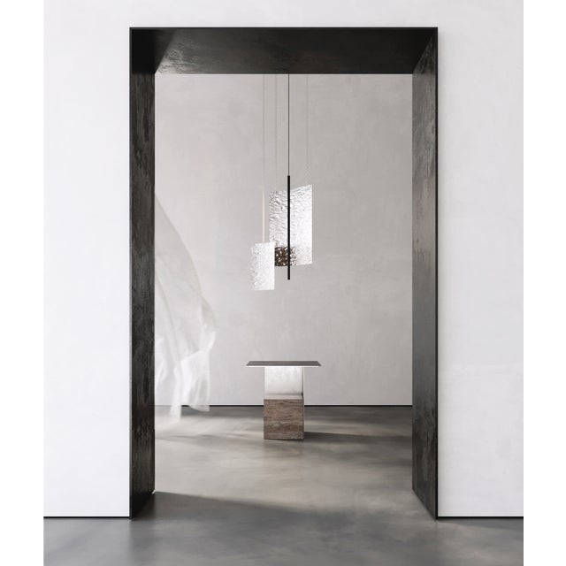 Svitlotin collection: where light meets shadow. These elegant curved pendant lights feature premium satin stainless steel...