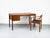 Danish teak desk with two drawers, the upper one lockable. A clean, timeless design with an elegant look. The drawers are...