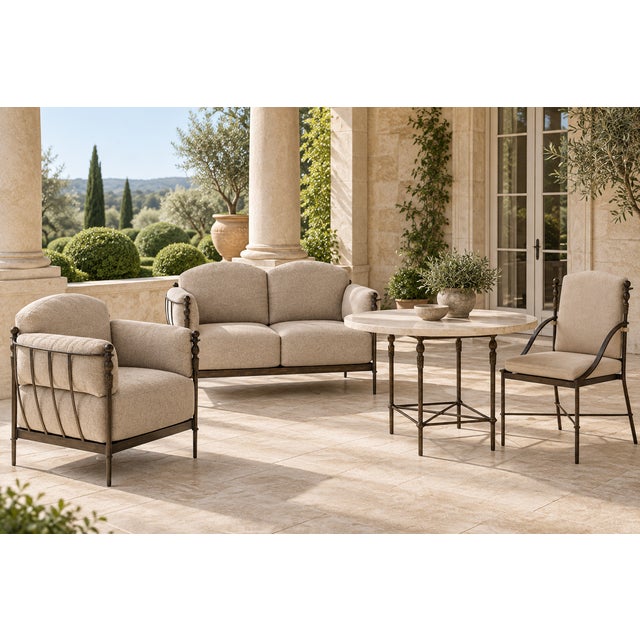 A refined outdoor dining table from Michael Taylor Designs, combining classical proportions with a robust architectural...