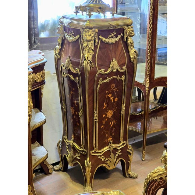 Magnificent French Rococo style pedestal column crafted from fine wood and richly adorned with ornate bronze accents and...