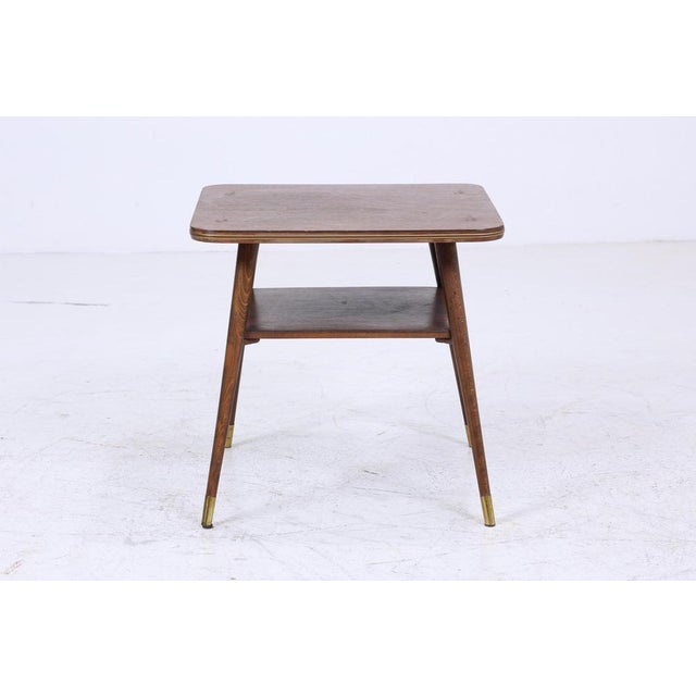 Vintage walnut side table from the 60s FEATURES * High-quality workmanship * Vintage design * Material: wood * Golden trim...