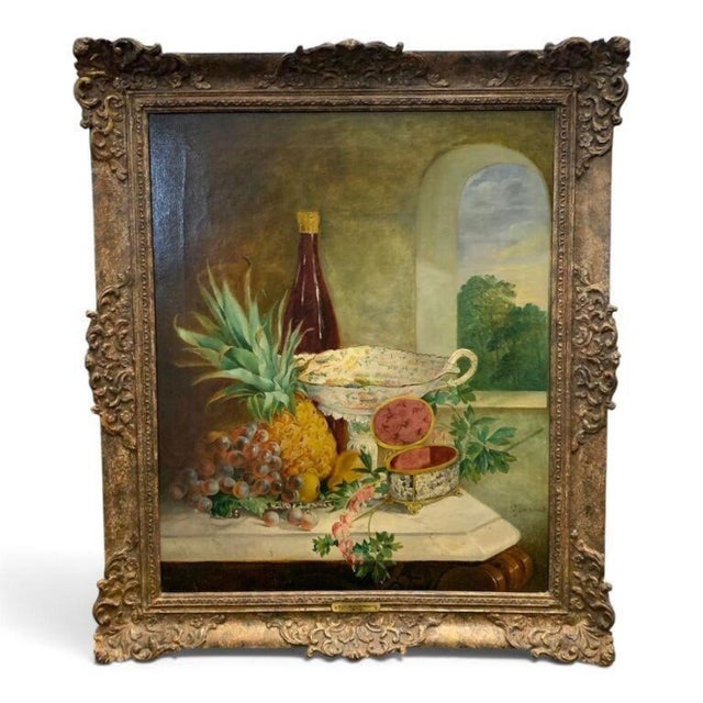A dated 1878 oil on canvas by E. J. Boussant, a lush still life of pineapple, grapes, and a footed compote beside a wine...