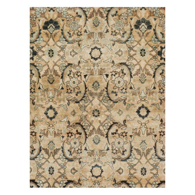 This early 20th-century Persian Lavar Kerman large carpet presents an elegant allover floral composition across a warm...