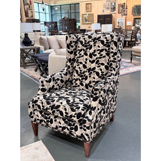 A timeless wingback chair by Sam Moore, celebrated for its quality American craftsmanship and enduring comfort. This...