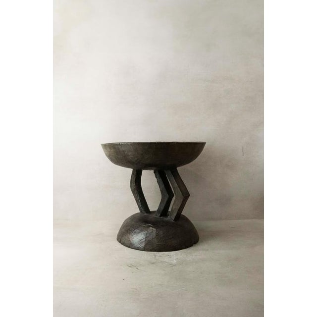 Hand-carved from a single piece of wood, the Tonga stool is a genuine artifact. These stools were status symbols for...