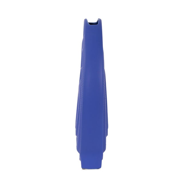 Elevate your decor with a striking fusion of form and color that adds a vibrant touch to any space. This versatile vase...