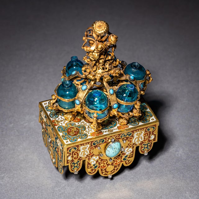 Finely crafted goldsmith’s work in the form of an sedan chair richly decorated with enamel. The piece features a small...
