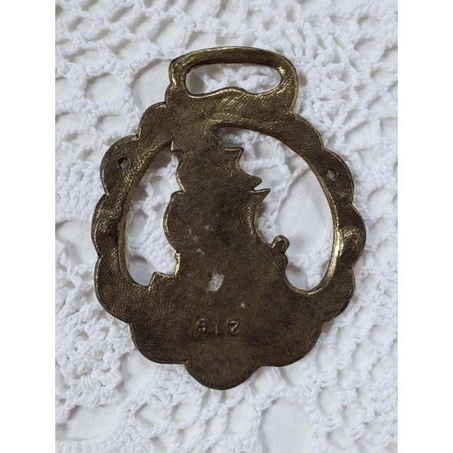 A brass metal ship medallion, measuring 3 ½” x 3" x ¼”. I'm not sure of the original purpose, but given it's size, this...