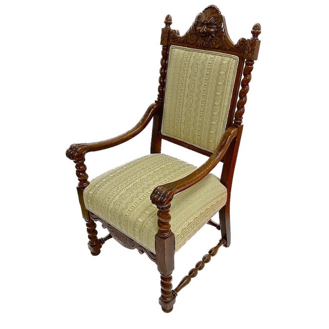 Antique barley twist and gargoyle face armchair with claw arms. Freshly upholstered in a neoclassical egg and dart...