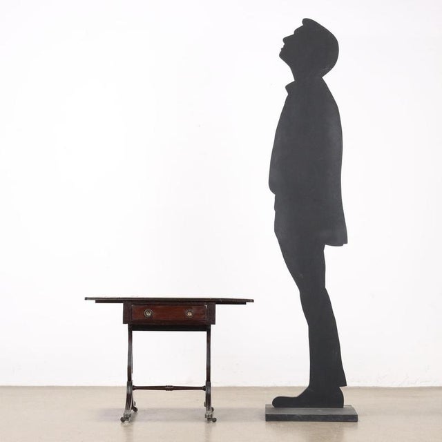 Mahogany coffee table with hinged sides. Drawer in the band under the top, lyre legs joined by a crosspiece and supported...