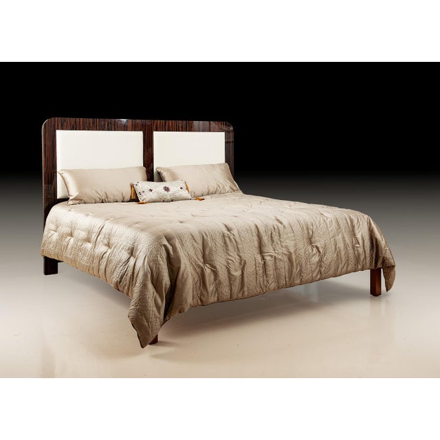 Contemporary King Size Bed. Crafted with a solid wood frame, the headboard and footboard are adorned with luxurious...