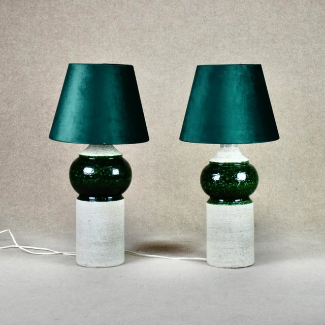 Two handmade lamps manufactured by Bitossi, imported and sold by Bergboms in Sweden. Height 37 and 38,5 cm. on the ceramic...