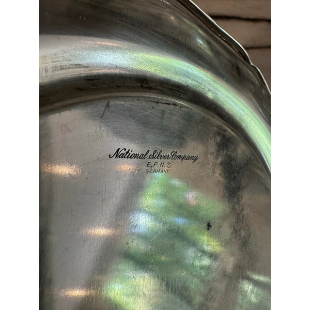 High quality vintage silver plated scalloped edge design bottle coaster or spoon rest plate. Marked National Silver...