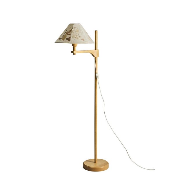Staken floor lamp designed by Carl Malmsten, Sweden, circa 1940s. An elegant example from one of Sweden's most celebrated...