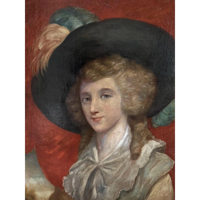 This portrait depicts an elegantly dressed young woman, turned three-quarters, gazing toward the viewer. She wears a wide...