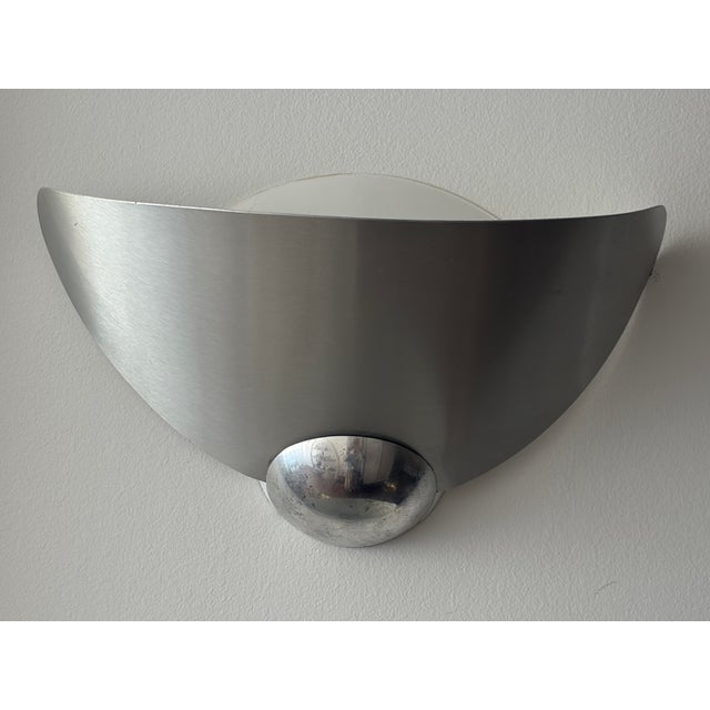 Pair of Aura wall lights made by the famous designer's Perry King & Santiago Miranda in 1989 and produced by Arteluce, the...