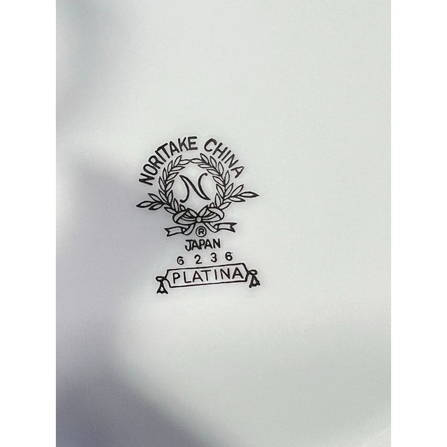 Noritake China Tea Pot or Coffee Pot. White with platinum trim. The marking on the bottom identifing it as Noritake China...