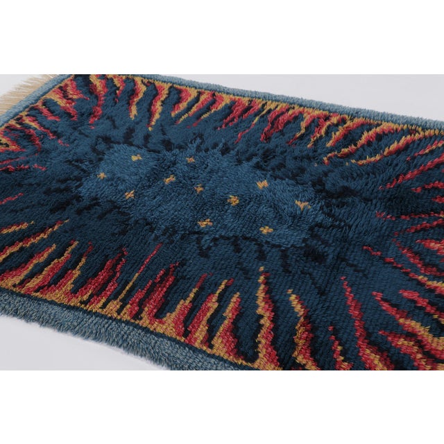 Hand-knotted in lush, high-pile wool in Sweden circa 1960-1970, this 5x6 vintage Swedish Rya rug is a bold new addition to...
