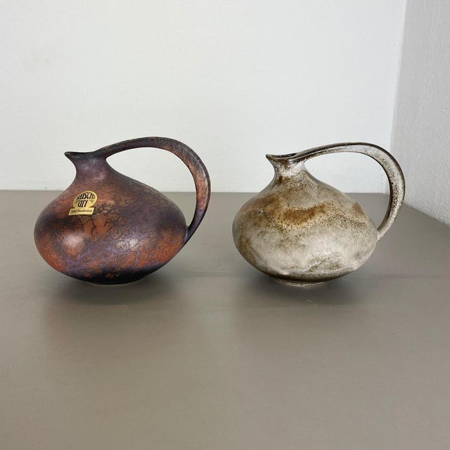 Article: set of 2 vases. Design: Kurt Tschörner. Producer: Ruscha, Germany. Decade: 1970s : This original vintage vase set...