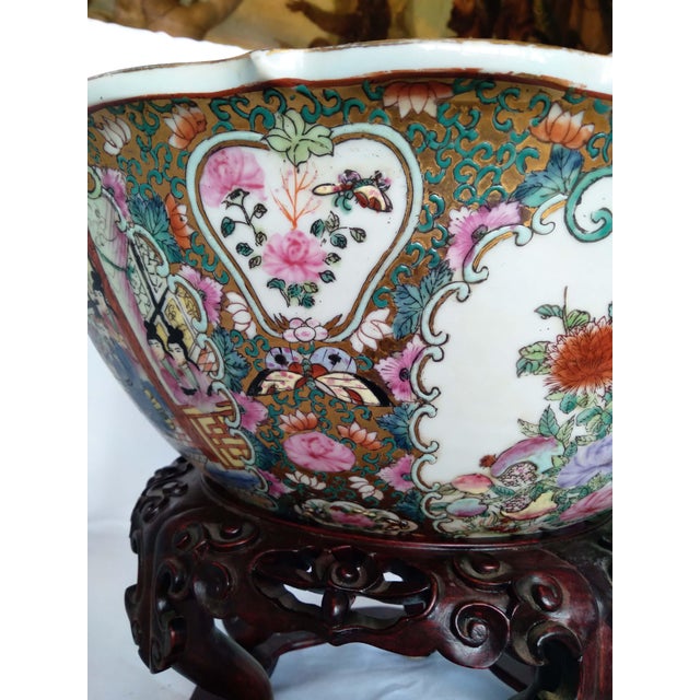 Chinese porcelain large famille rose / Rose Mandarin-style punch bowl, bearing an apocryphal red seal mark, probably late...
