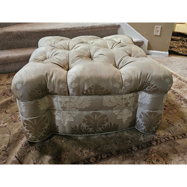 Elegant silk damask tufted, upholstered ottoman. Neutral tone on tone patter will enhance many design themes.