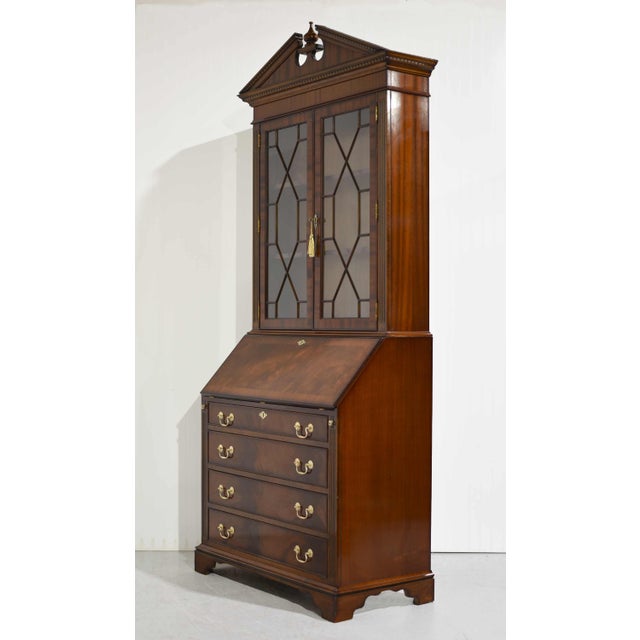 This stunning Mid-Century American Colonial Revival Butler’s Secretary Desk is a refined blend of function and...