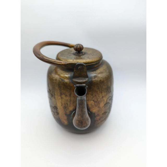 Stunning gold guilted bronze water pitcher dating from around 1750 A.D. Large barrel shaped body adorned with delicately...