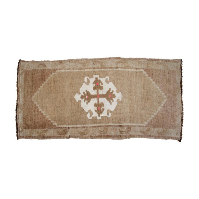 This authentic hand-knotted small rug from Kars captures the rugged soul of East Anatolian weaving traditions. Its compact...