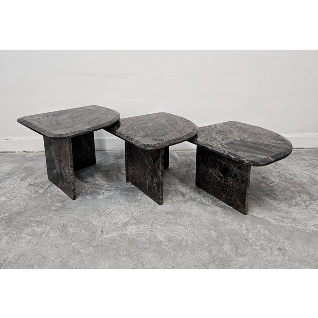 In this listing you will find a set of three Postmodern nesting tables done in natural granite, with beautiful top shape....