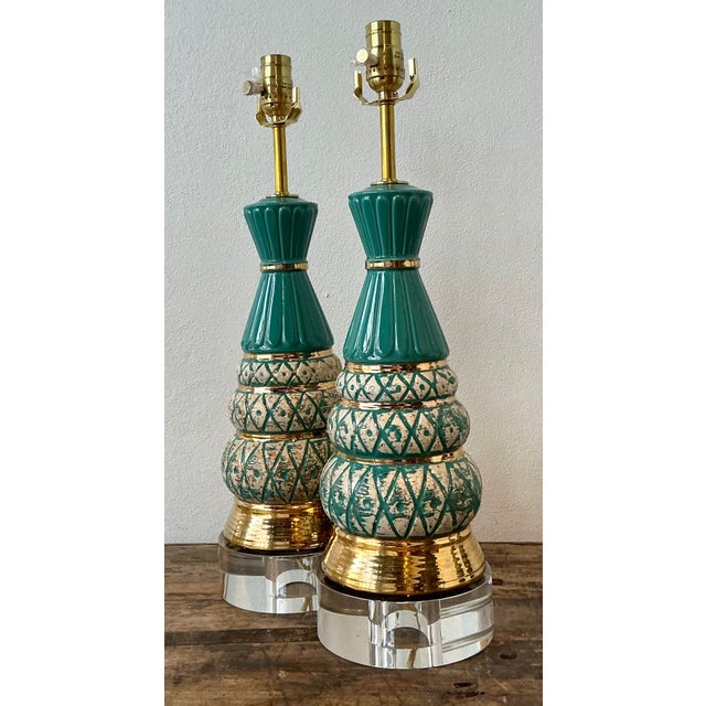Add a vibrant pop of Mid-Century Modern color to your interior with this exceptional pair of glazed ceramic table lamps....