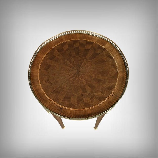 This delicate Louis XVI style pedestal table captivates with its harmonious proportions and rich details. The circular...