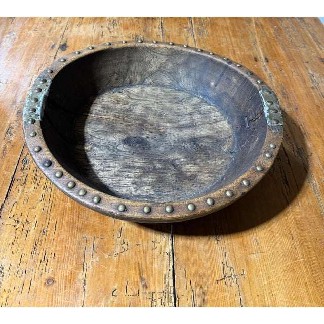 An extraordinary antique-style primitive wooden bowl displaying wonderful craftsmanship, historic character, and...