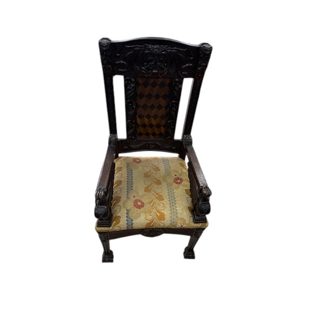 These are a beautiful set of American carved oak chairs. They are heavily carved, have a parquetry panel and carved feet....