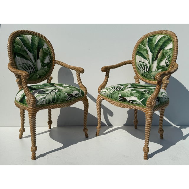 Pair of Floridian Palm Beach Regancy faux Bois hand carved rope and tassel armchairs upholstered in tropical theme fabric....