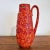 A large Scheurich Keramik Europe Line pitcher vase in the Bernina relief decor with a very bright all-over red and orange...