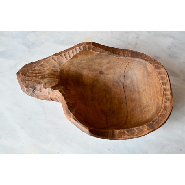 A piece of antique Provençal craftsmanship, this fruit bowl, hand-carved from a single block of solid wood, reflects the...