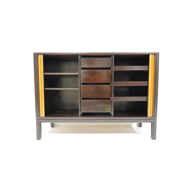 Not often seen, a fully restored tambour door chest by Edward Wormley for Dunbar. The cabinet featrues two tambour doors...