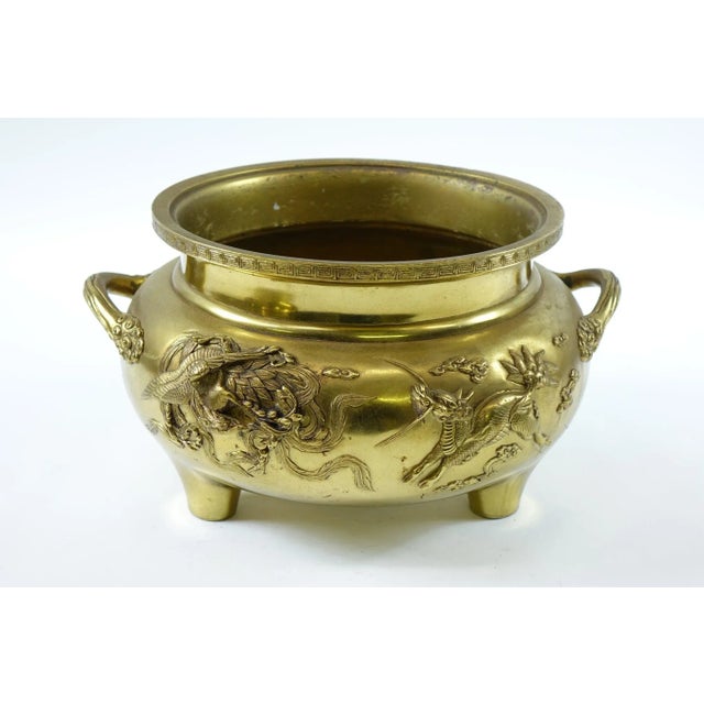 Early 20th Century Brass Chinese Flower Pot with Saucer – Dragon Design This early 20th-century Chinese brass flower pot...