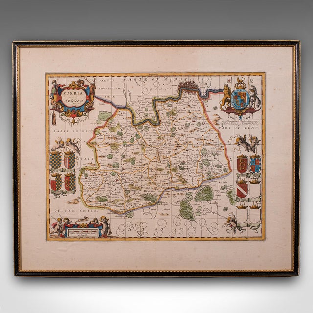 This is an antique map of Surrey. An English, framed cartography engraving by Willem Janszoon Blaeu, this centre fold...