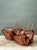 These vintage Paul Frankl six-strand rattan lounge chairs bring mid-century modern character to a room through their...
