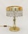 Art Nouveau floor lamp Art Nouveau table lamp, circa 1910. Brass. The shade's top edge is chased and detailed. Glass bead...