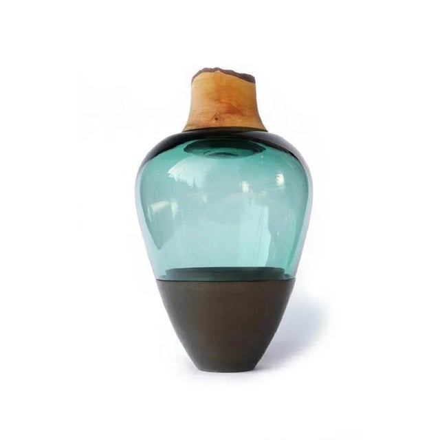 Green blue and brass patina india vessel i, pia wüstenberg. Dimensions: d 20 x h 38. Materials: glass, wood, brass. this...