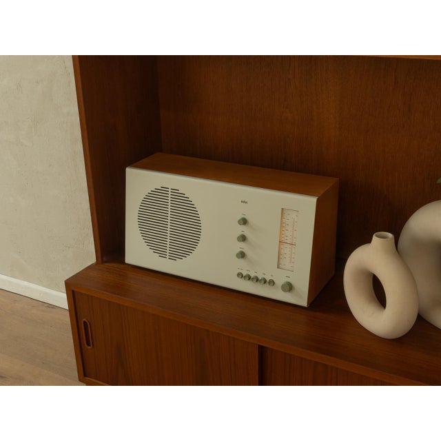 The rt 20 design classic by dieter rams for braun from 1961. A table radio with an ash veneered wooden cabinet and a white...