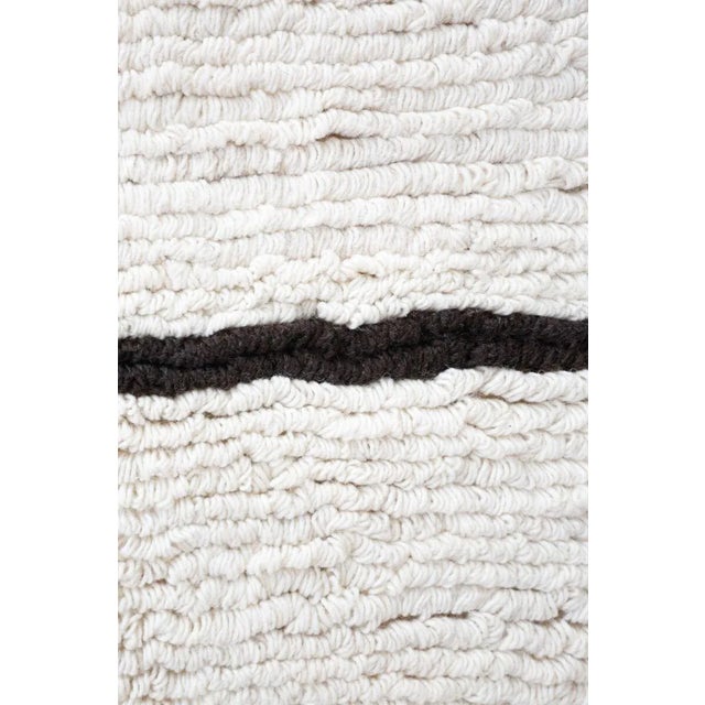 Inspired by the traditional looped Bnchra rugs of the Beni Ourain tribe our looped pile rug is very unique as it is...