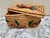 Vintage woven decor and storage basket with woven texture and whimsical floral patterned accents.