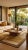The Zen Garden Cocktail Table showcases Oggetti's iconic Showtime veneer, where ribbons of rattan are inlaid to create...
