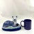 Wonderful recumbent mantle cat painted in blueish gray colors. I love the ball in his front paws. Nice large size that...