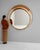 Here is a mirror, its whitewashed distressed round frame the first thing to catch the eye. Dating to 20th Century and...