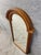 A beautiful antique walnut and burl wood arched wall mirror, dating to approximately the 1920s, with a substantial...