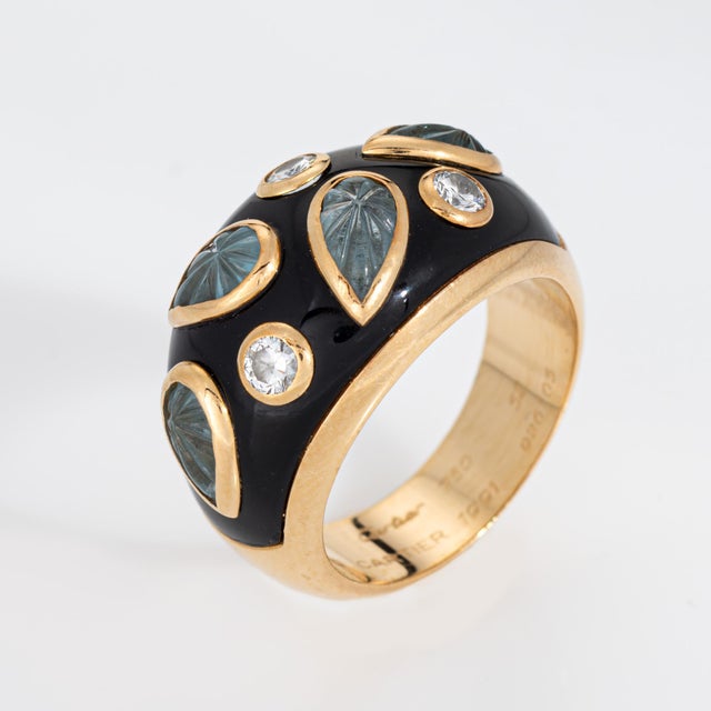 Vintage Cartier carved aquamarine & diamond ring crafted in 18k yellow gold (circa 1991). Carved aquamarines measure 6mm x...